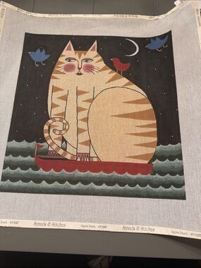 needlepoint canvas featuring a cat on a boat folk art  , 🐈‍⬛